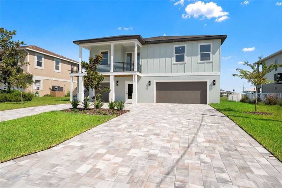 Front exterior of a new home in , Hernando Beach, FL, highlighting curb appeal (Image 27). Front exterior of a new home in , Hernando Beach, FL, highlighting curb appeal (Image 27).