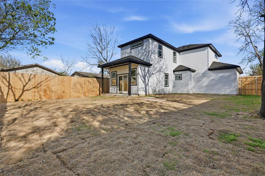 Rear view of house with a fenced backyard Rear view of house with a fenced backyard