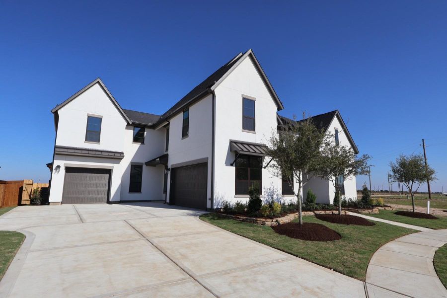 Front exterior of a new home in Dunham Pointe 80′, Cypress, TX, highlighting curb appeal (Image 2). Front exterior of a new home in Dunham Pointe 80′, Cypress, TX, highlighting curb appeal (Image 2).