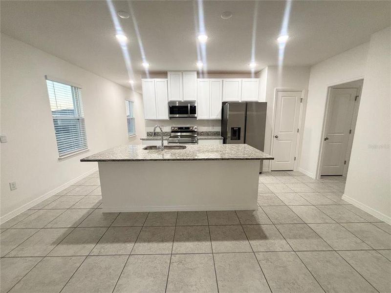 Furnished interior view inside a new home in Lake Deer Estates, Poinciana (Image 4).