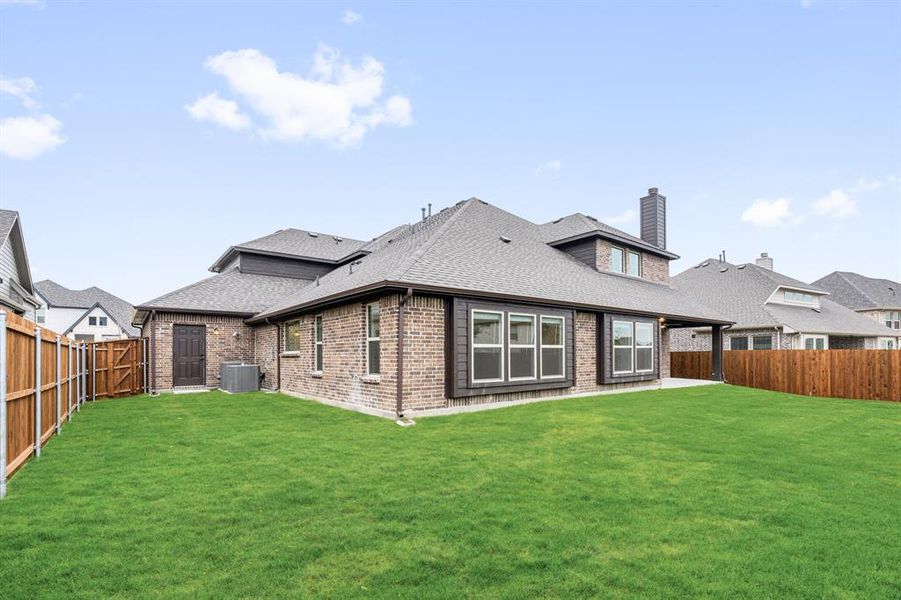Exterior details and patio area of a home in Villages of Hurricane Creek, Anna (Image 27).