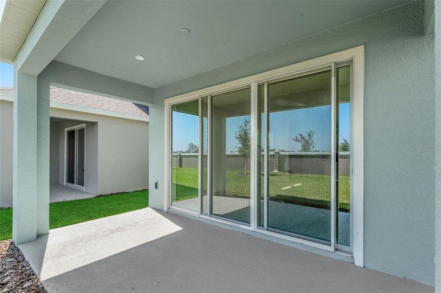 Exterior details and patio area of a home in Seaire, Parrish (Image 3).