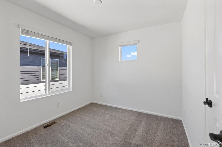 Spacious, unfurnished interior of a new home in Woodrose at Painted Prairie, Aurora (Image 14).
