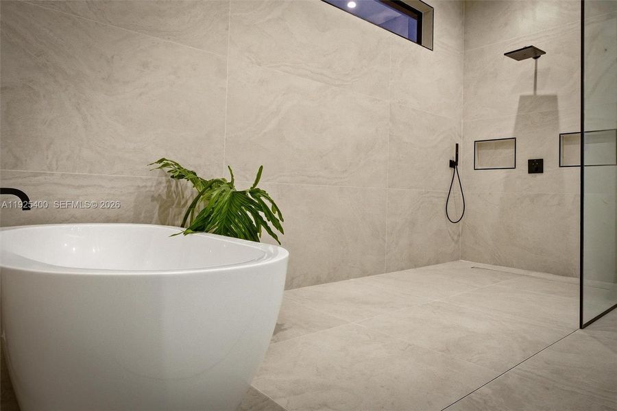 Primary Bath | Soaking Tub & Rain Shower | Floor-to-Ceiling Tile | Spa Finishes Primary Bath | Soaking Tub & Rain Shower | Floor-to-Ceiling Tile | Spa Finishes