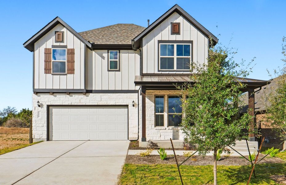 Front exterior of a new home in Saddleback at Santa Rita Ranch, Liberty Hill, TX, highlighting curb appeal (Image 22).