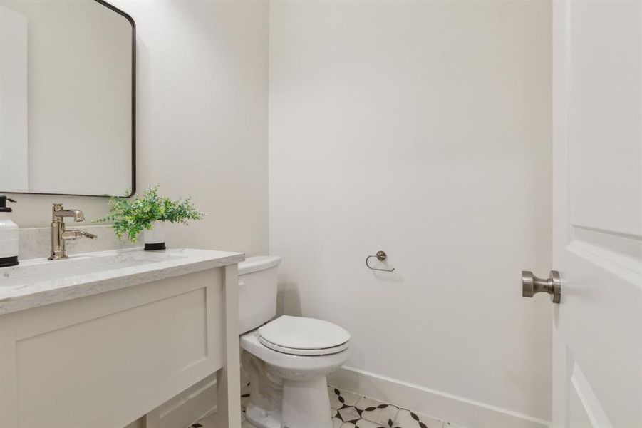 Bathroom featuring vanity and toilet