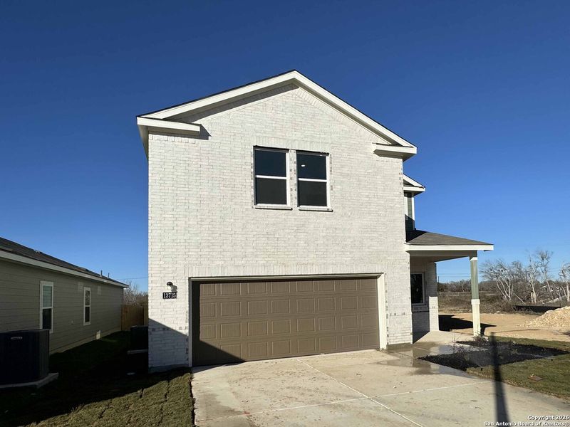 Front exterior of a new home in Meadows at Hennersby Hollow 40's, San Antonio, TX, highlighting curb appeal (Image 20). Front exterior of a new home in Meadows at Hennersby Hollow 40's, San Antonio, TX, highlighting curb appeal (Image 20).
