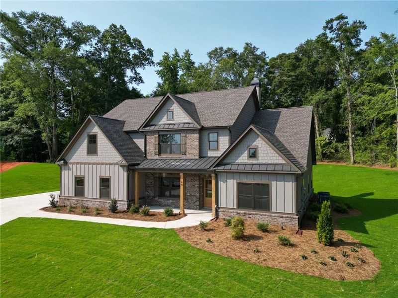 Front exterior of a new home in Grove Park, Covington, GA, highlighting curb appeal (Image 22).