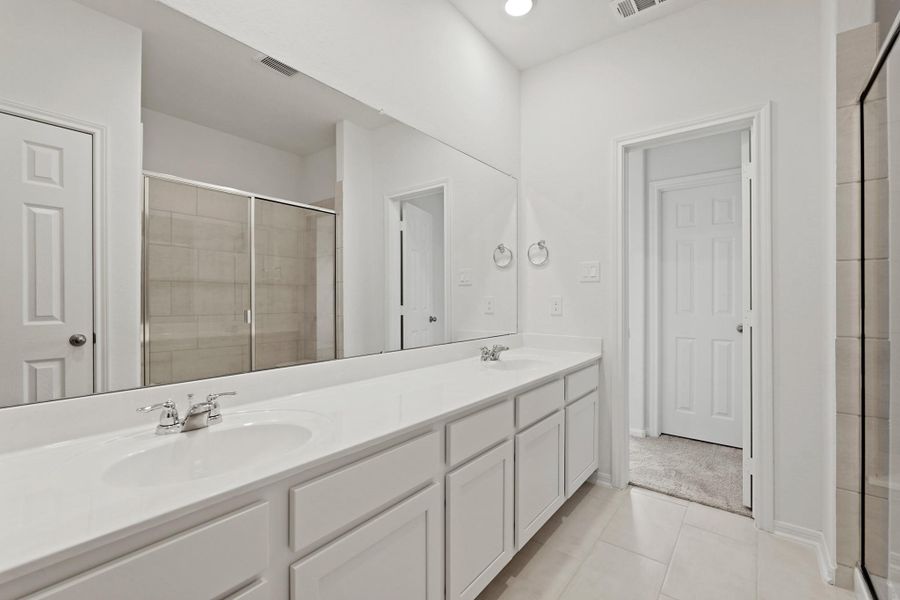 The en-suite bathroom offers a spa-like atmosphere with its elegant design, high end finishes, and tasteful lighting, creating a retreat within your own home. The en-suite bathroom offers a spa-like atmosphere with its elegant design, high end finishes, and tasteful lighting, creating a retreat within your own home.