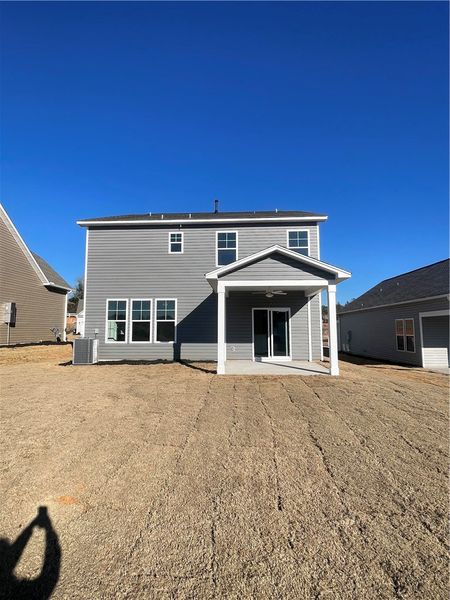 Exterior details and patio area of a home in Springwood Grove, Central (Image 17).