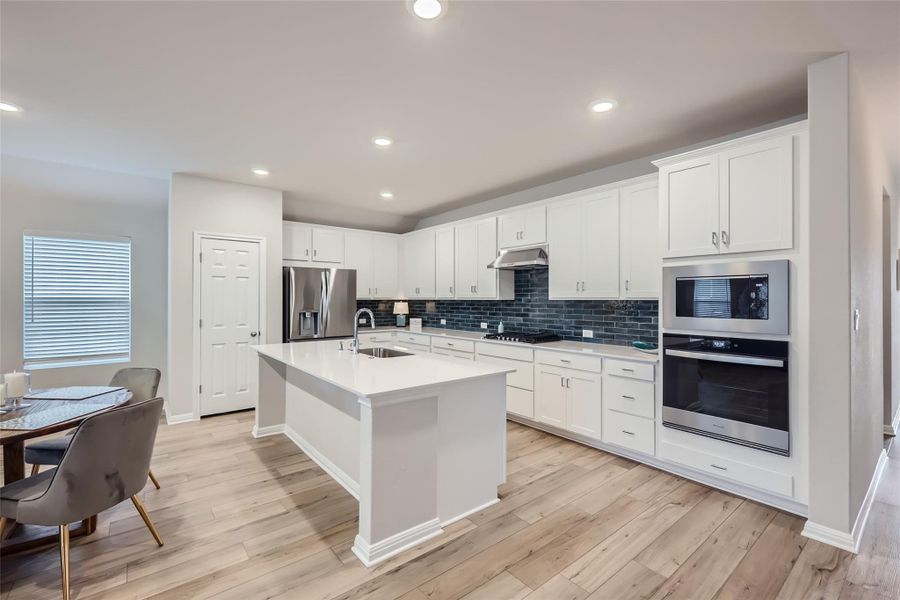 This grand, gourmet kitchen will inspire even the greatest of chefs, providing plenty of space and features to create meals that will bring everyone to the table!