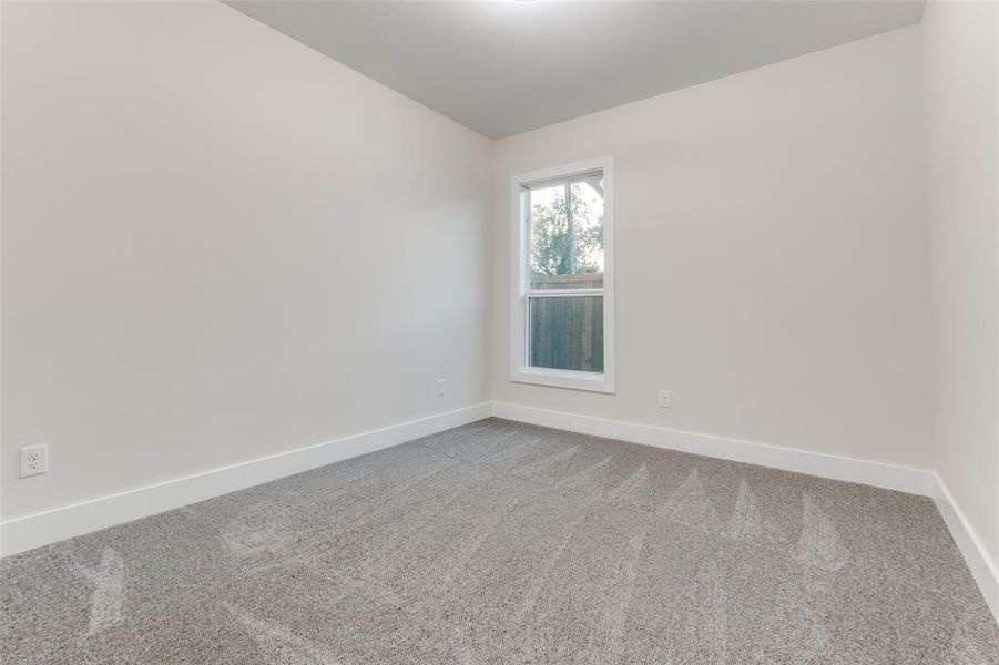 Empty room featuring carpet flooring