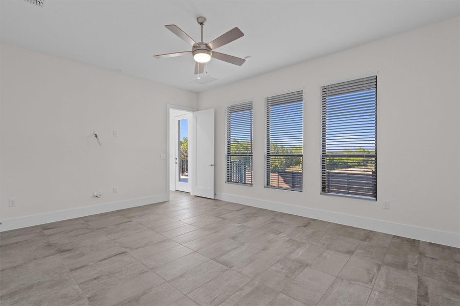 Spare room with baseboards and a ceiling fan Spare room with baseboards and a ceiling fan