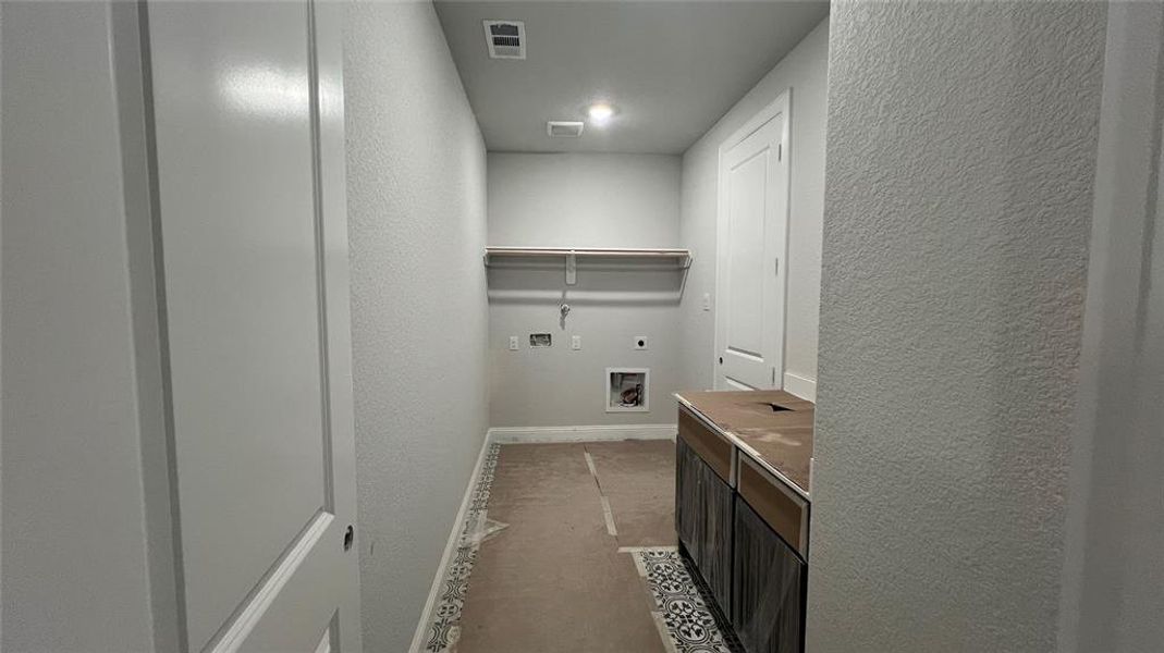 Laundry Room with Cabinet and Sink