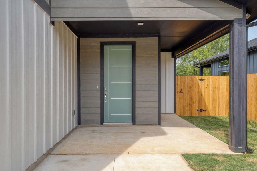 Spacious front patio with gate to backyard Spacious front patio with gate to backyard