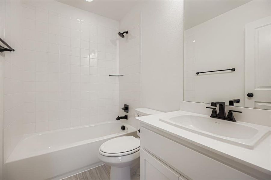 Bathroom with vanity and shower / washtub combination