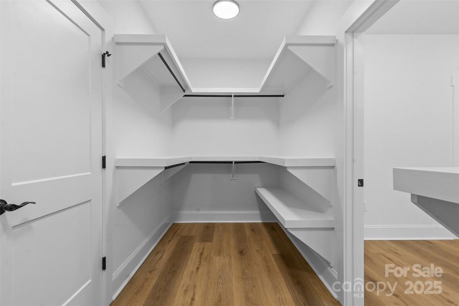 *representative photo- WIC w/ custom shelving- connects to primary ensuite bath & laundry room!