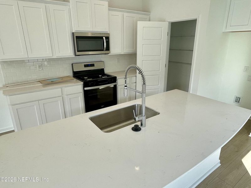 Furnished interior view inside a new home in Grand Reserve, Bunnell (Image 4).
