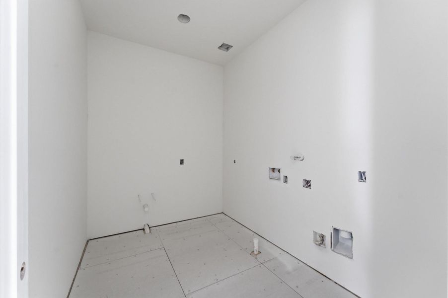 Upstairs laundry room.