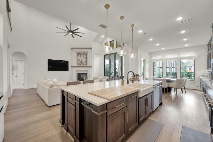 The oversized island provides seating, workspace, and a natural gathering place.