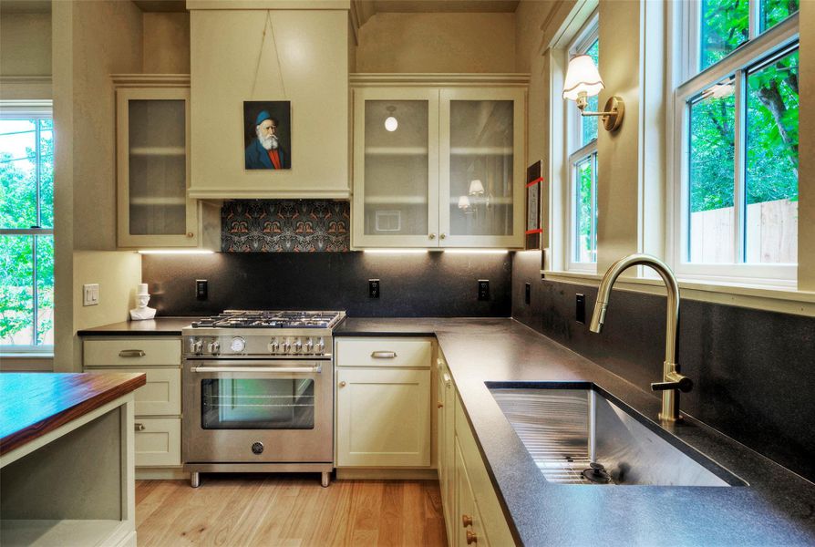Culinary aspirations meet functional design in this well-appointed kitchen.