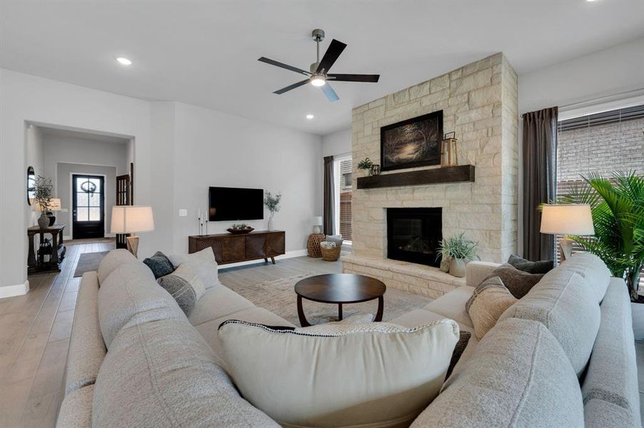 Gorgeous living room centered around fireplace