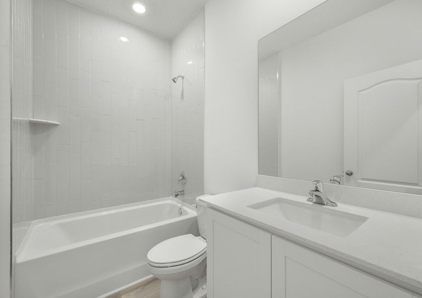 The secondary bathroom with a shower tub combo