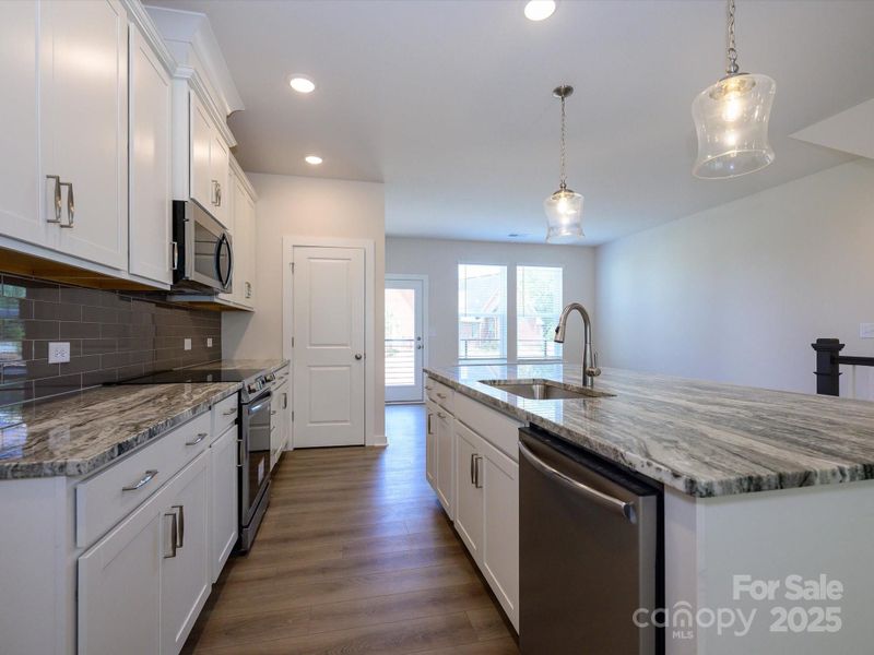 Furnished interior view inside a new home in Central Living at Craig, Charlotte (Image 8).