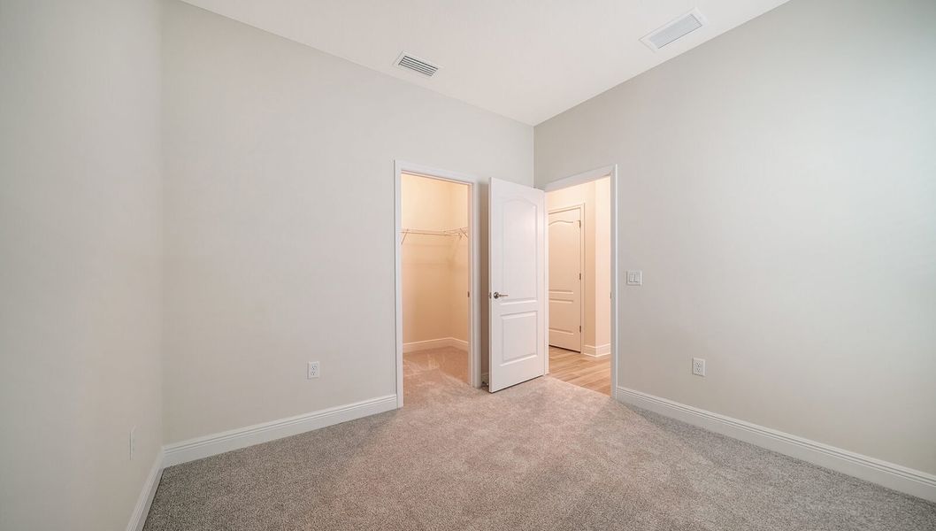 Spacious, unfurnished interior of a new home in Wildleaf at North River Ranch, Parrish (Image 25).