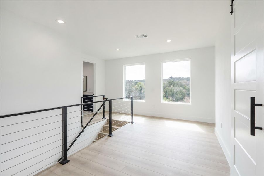 Spare room featuring recessed lighting and light wood finished floors