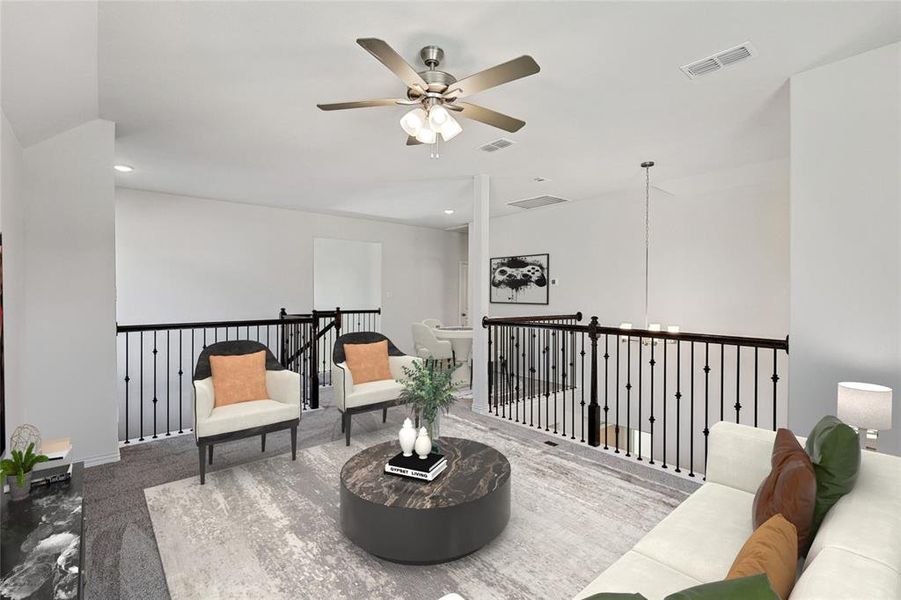 Sitting room featuring ceiling fan