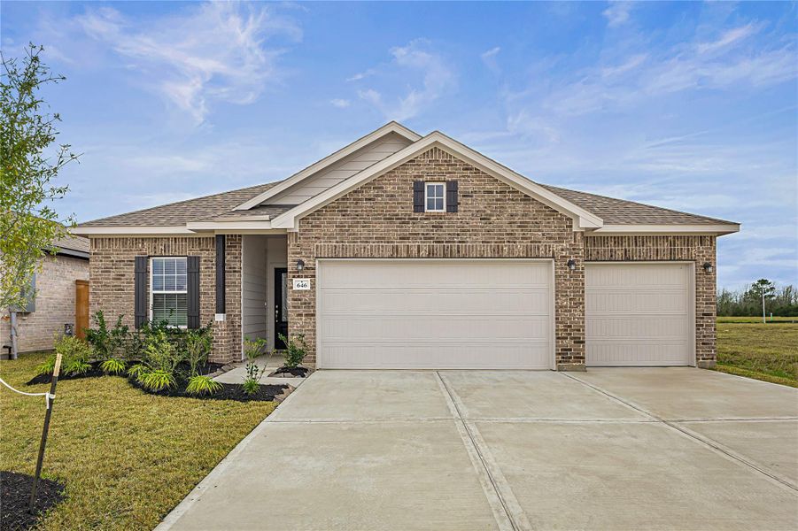 Front exterior of a new home in River Ranch Meadows, Dayton, TX, highlighting curb appeal (Image 17).