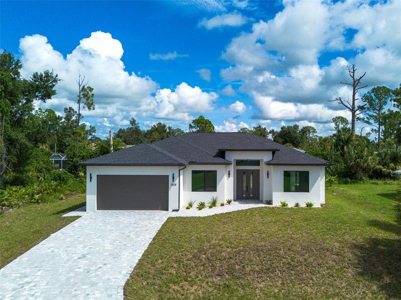 Front exterior of a new home in , North Port, FL, highlighting curb appeal (Image 28).
