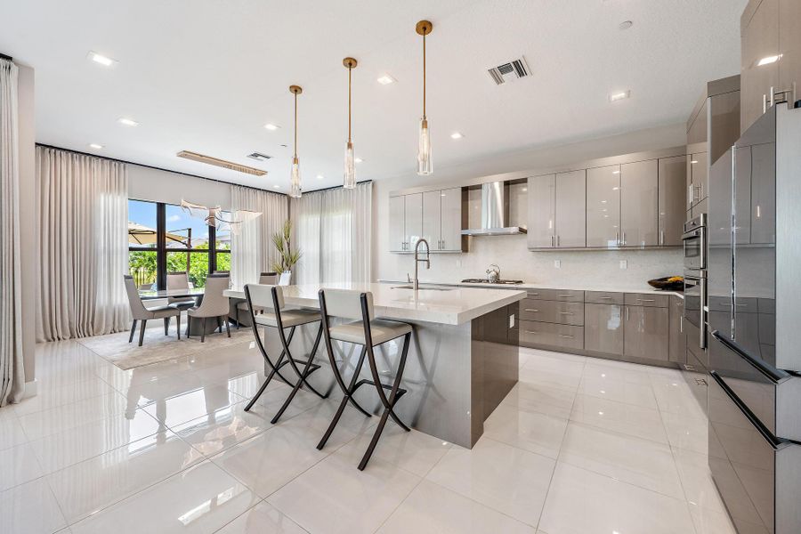 Complete with a gas range, high-end appliances, and upgraded finishes.
