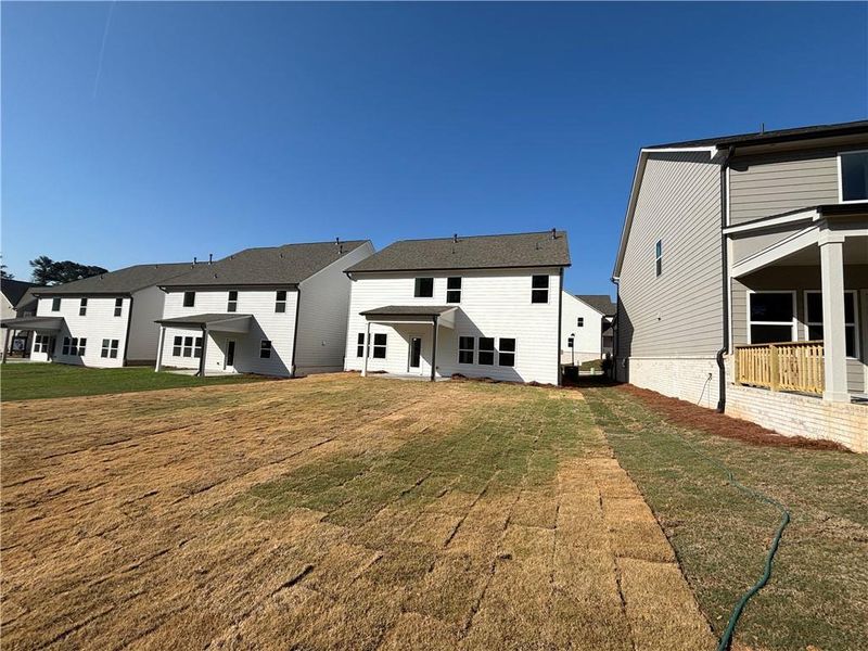 Exterior details and patio area of a home in Arbors at Richland Creek, Buford (Image 18).