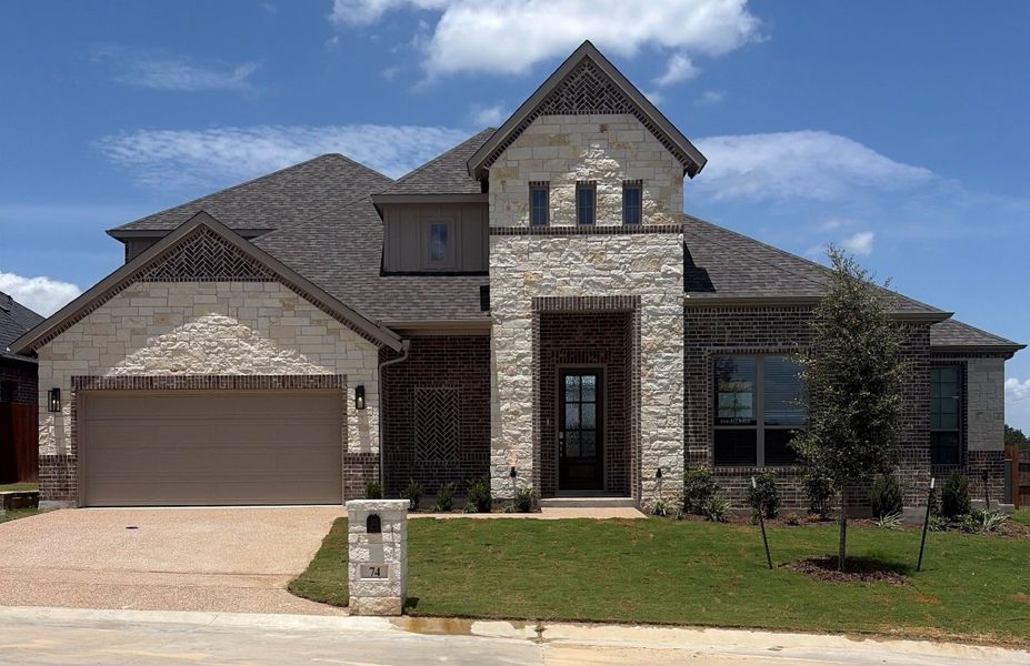 Front exterior of a new home in Lake Forest, Woodway, TX, highlighting curb appeal (Image 1). Front exterior of a new home in Lake Forest, Woodway, TX, highlighting curb appeal (Image 1).
