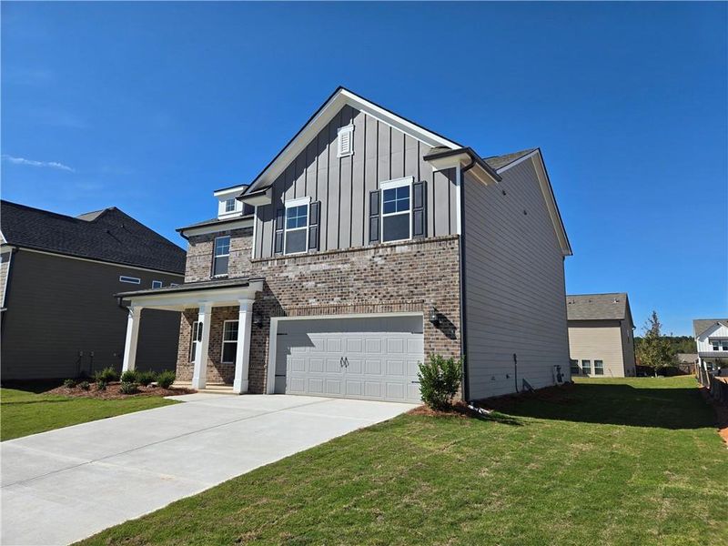 Front exterior of a new home in Enclave at Logan Point, Loganville, GA, highlighting curb appeal (Image 19).