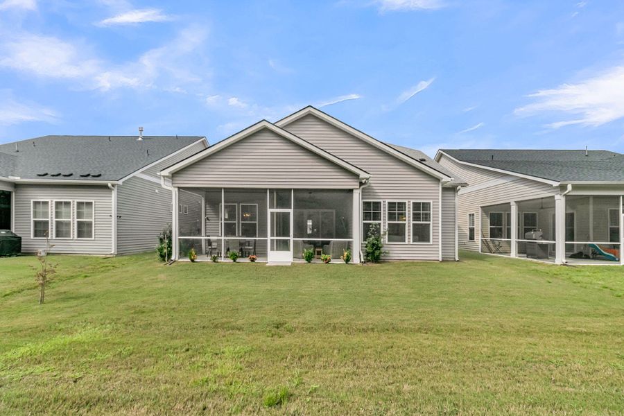 Exterior details and patio area of a home in Summerwind Crossing at Lakes of Cane Bay, Summerville (Image 4).