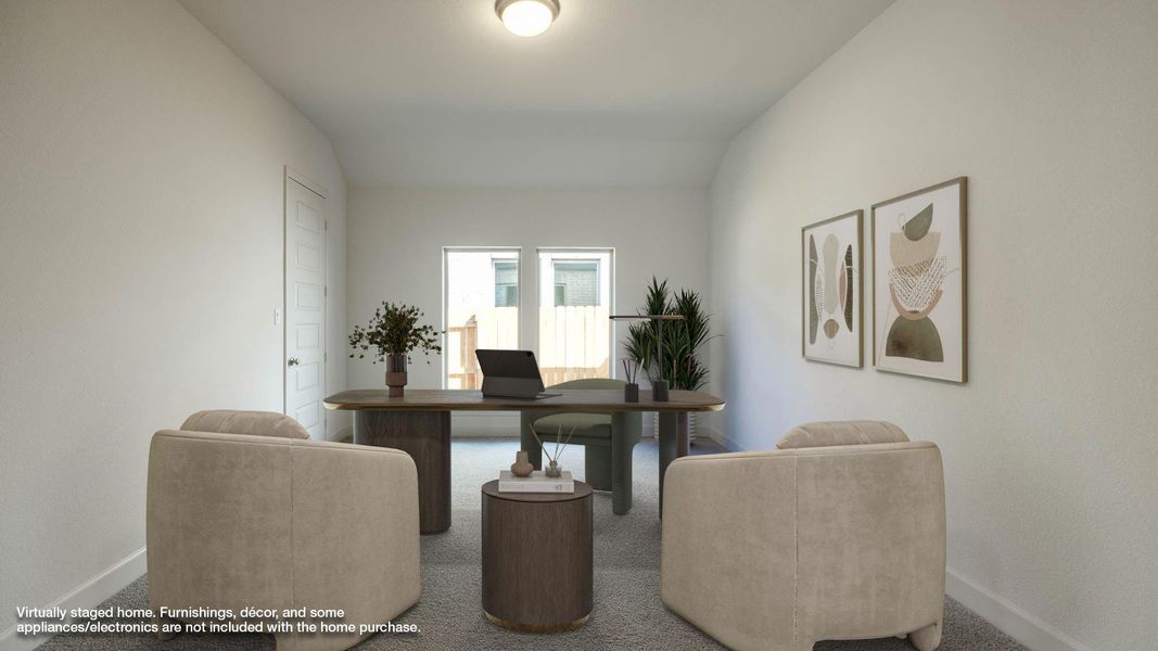 Carpeted home office with baseboards and lofted ceiling