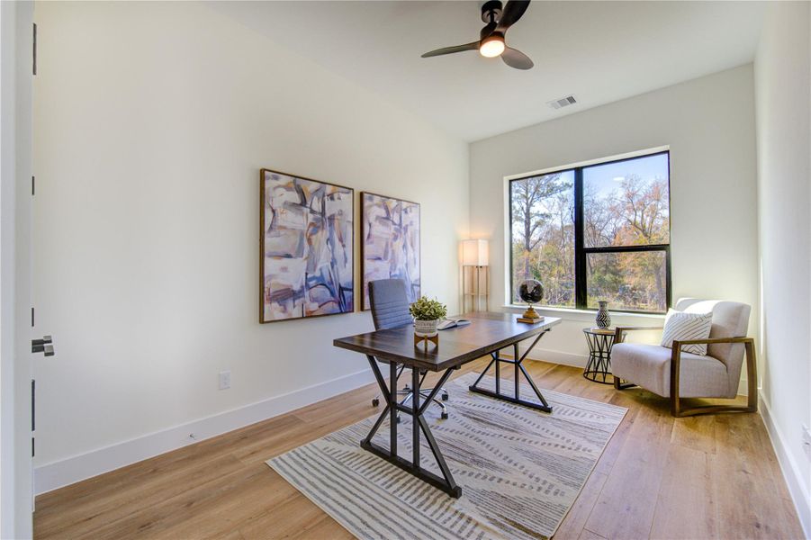Located on the second floor, this bright third bedroom offers serene views and modern finishes.