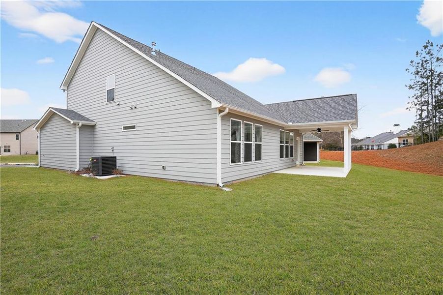 Exterior details and patio area of a home in The Fairways at Mirror Lake, Villa Rica (Image 20).