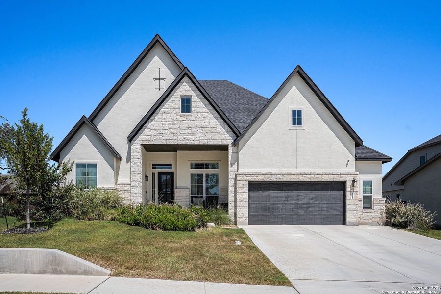 Front exterior of a new home in Mesa Western, Cibolo, TX, highlighting curb appeal (Image 2).