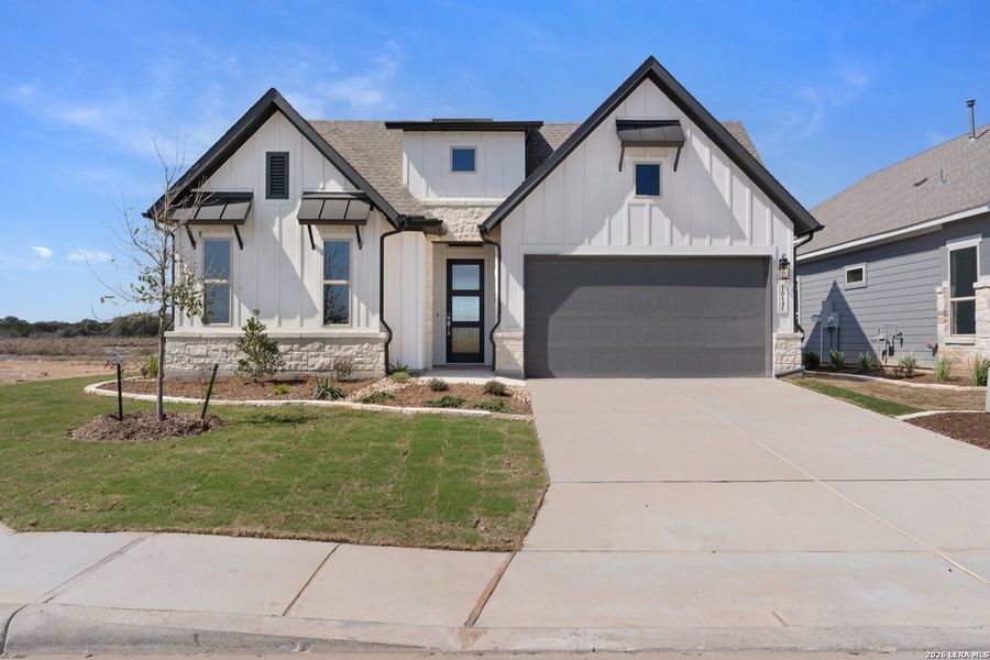 Front exterior of a new home in Davis Ranch, San Antonio, TX, highlighting curb appeal (Image 2).