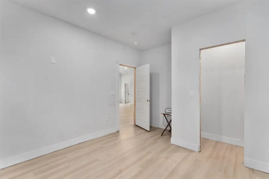 Unfurnished bedroom featuring light wood-style floors and recessed lighting Unfurnished bedroom featuring light wood-style floors and recessed lighting