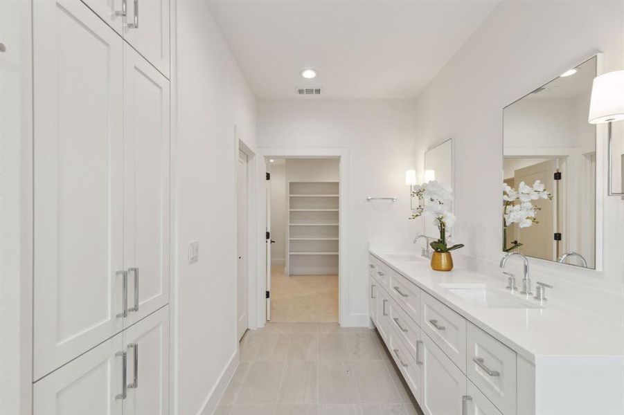 Bathroom with tile patterned flooring and vanity