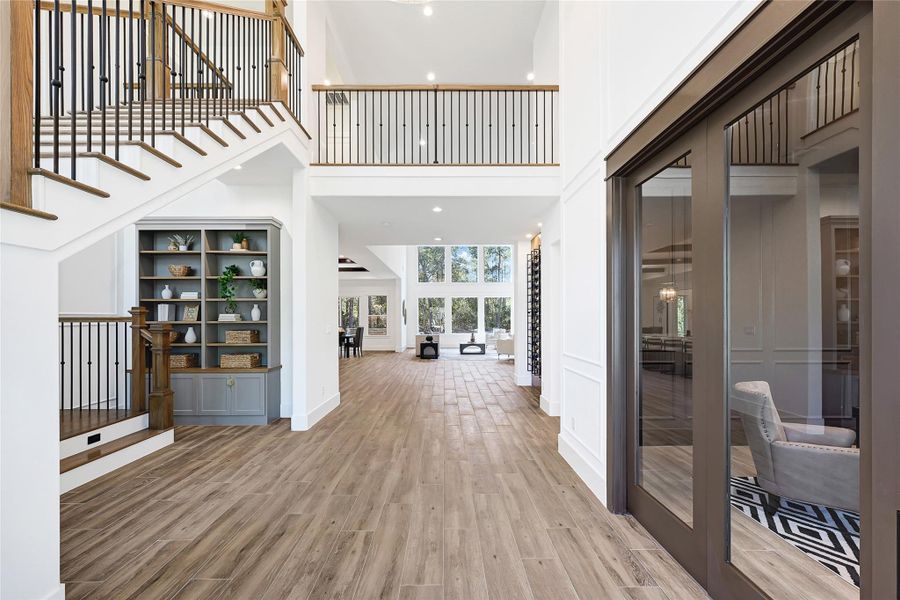 Grand Foyer with inviting floating staircase