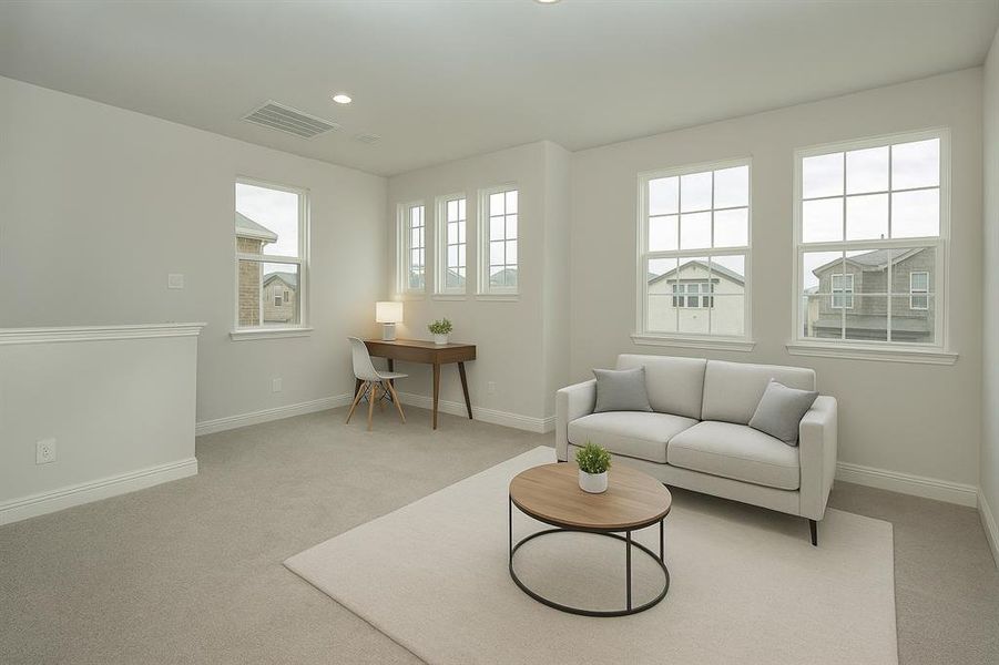 Living area with light colored carpet and recessed lighting Living area with light colored carpet and recessed lighting