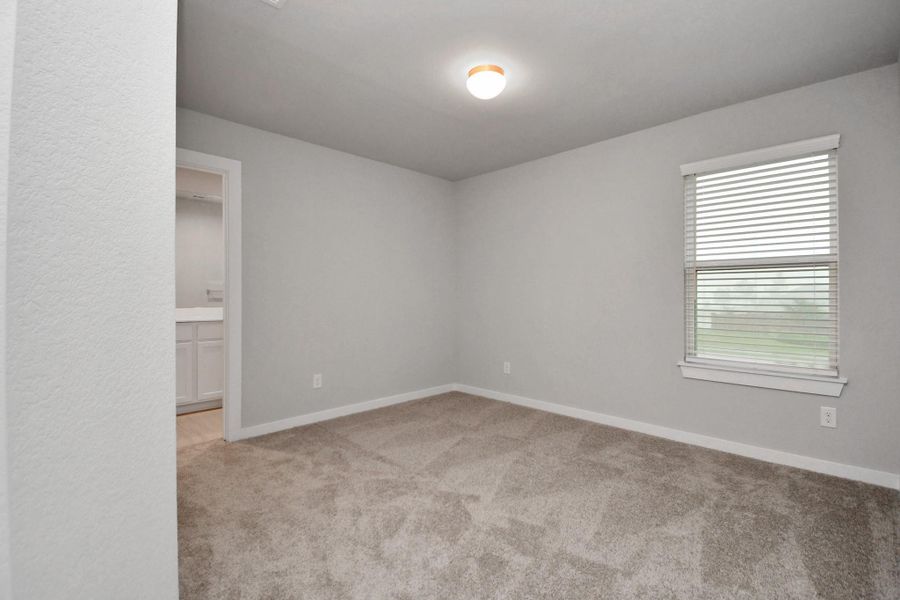 Guest suite features plush carpeting, large windows that let in plenty of natural light, bright paint, and spacious closets Sample photo of completed home with similar floor plan. Actual colors and selections may vary. Guest suite features plush carpeting, large windows that let in plenty of natural light, bright paint, and spacious closets Sample photo of completed home with similar floor plan. Actual colors and selections may vary.