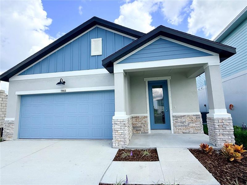 Front exterior of a new home in , Hudson, FL, highlighting curb appeal (Image 28).