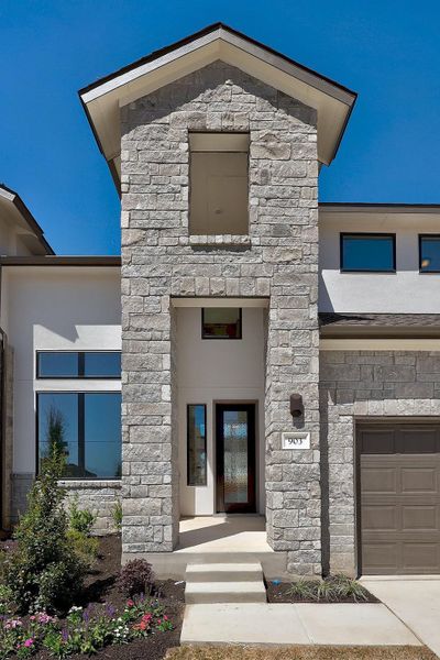 Front exterior of a new home in Lariat, Liberty Hill, TX, highlighting curb appeal (Image 21). Front exterior of a new home in Lariat, Liberty Hill, TX, highlighting curb appeal (Image 21).